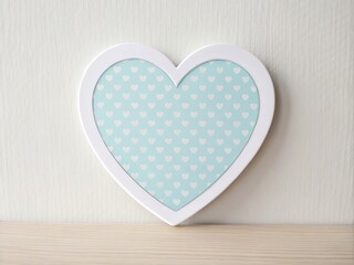 Obraz premium Delicate heart shaped cutout sticker with pastel color blue for nursery or playroom interior