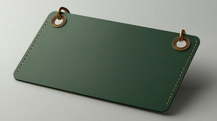 Stylish green leather tag with metal eyelets, perfect for branding or decorative purposes