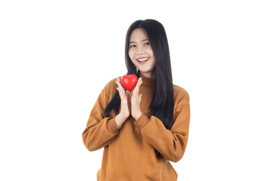 Young Asian woman holding red heart isolated on white background with clipping path. Health insurance, donation charity concept.