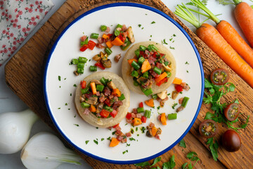 Baked onions stuffed with healthy vegetables. Top view table.