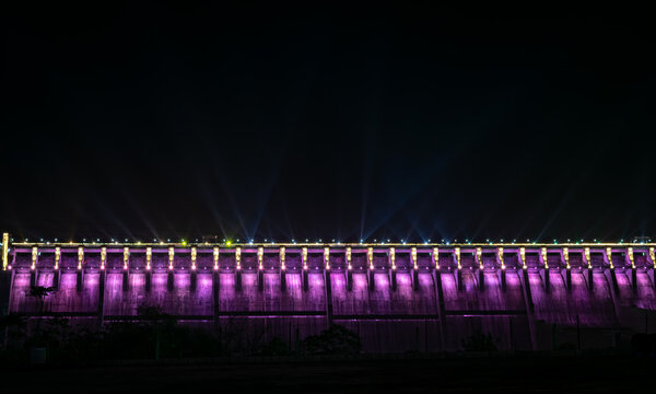 Night image of Sardar Sarovar Dam Illuminated with thousands of LED bulbs , is a place of tourist attraction near statue of unity in Kevadia, India.