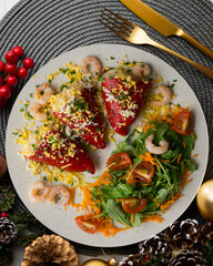 Red piquillo peppers stuffed with shrimp. Traditional Spanish tapa on Christmas table.