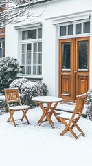 Fototapeta premium Two wooden chairs and a table in the snow