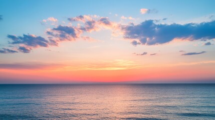 Fototapeta premium Serene ocean at sunset with colorful sky, tranquil scene. Nature and relaxation concept