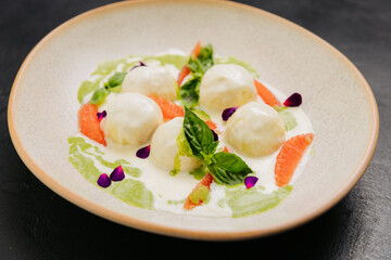 Gourmet cheese balls with herbs and citrus on an plate, perfect for culinary and food photography