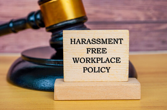 Harassment free workplace policy text written on wooden board with gavel background. Safe workplace concept