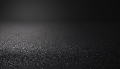 Dark textured background with subtle lighting and a blurred out-of-focus background.