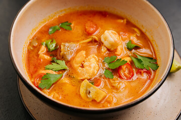 Spicy Thai Authentic Tom Yum soup with shrimp, mushrooms, and herbs, perfect for culinary projects