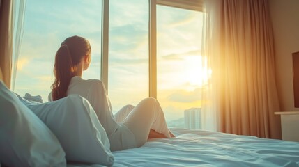 Life balance and relaxation concept with young Asian girl lifestyle simply waking up in the morning take it easy having some rest in luxury hotel room or home bedroom