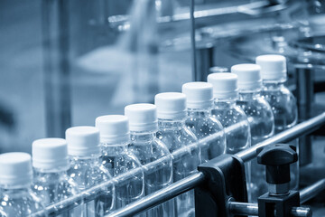 The hi-technology of drinking water manufacturing process in the light blue scene.