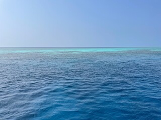 Fototapeta premium Tropical Destination - Maldives - Pier For Paradise Island, beach with clear blue water. Summer vacation background. Exotic island 