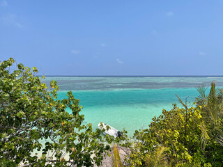 Tropical Destination - Maldives - Pier For Paradise Island, beach with clear blue water. Summer vacation background. Exotic island 