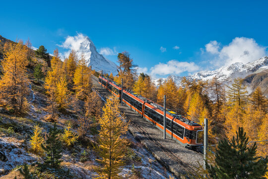 Zermatt Switzerland nature landscape of Matterhorn mountain peak and Gornergrat bahn train in Autumn Season