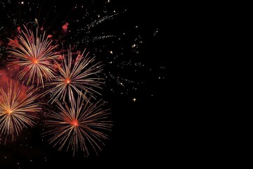 Fireworks exploding in the night sky with trails of light