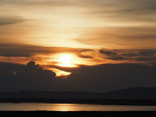 Beautiful orange sky shines before the sun sets.