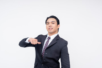 A cocky young asian business executive pointing to himself, reminding that he is the boss. Isolated on a white background.