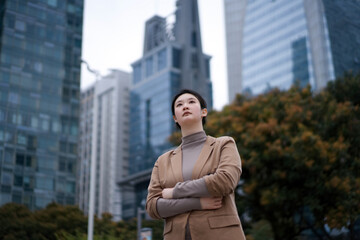 Confident Businesswoman in Urban Landscape: A Modern Portrait