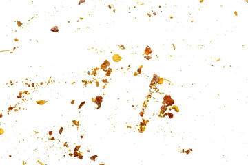 dried red chili pepper flakes and seeds isolated on white background
