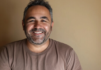 Fototapeta premium Portrait Of a Confident Young Smart Looking Man Wearing a Brown T-shirt