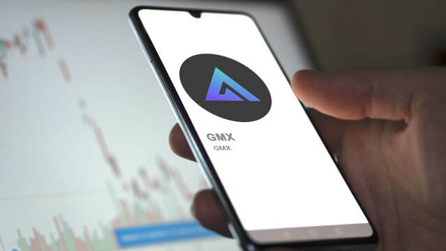 Close up on logo of (GMX) GMX on the screen of an exchange. (GMX) GMX price stocks, $GMX on a device.