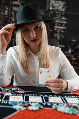 Fototapeta premium Pretty young women posing at playing table in casino