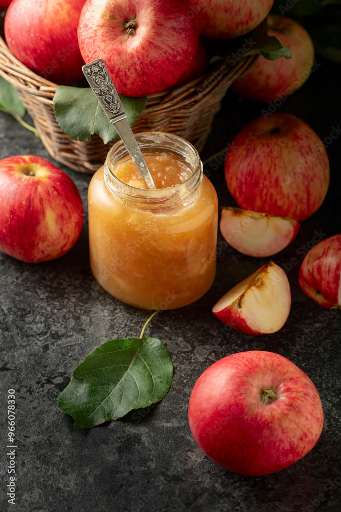 Poster Apple jam and fresh apples on a black stone table.