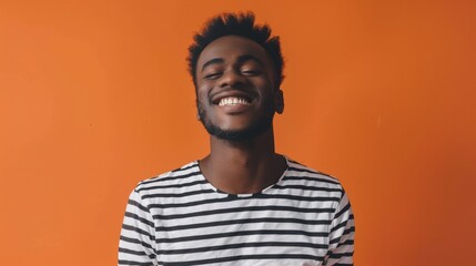 Fototapeta premium portrait of a black man on orange background