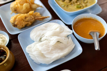Kanom jeen nam ya ; Rice noodles in fish curry sauce. Traditional Thai cuisine, rice vermicelli served.