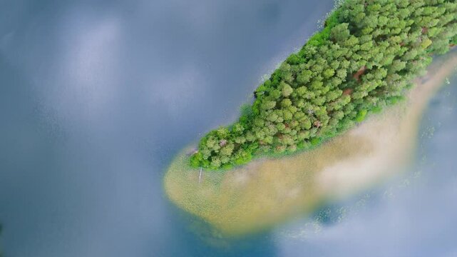 Scenic aerial rotating view of Sciuro Ragas peninsula, separating White Lakajai and Black Lakajai lakes. Picturesque landscape of Labanoras Regional Park. Natural beauty of Lithuania.