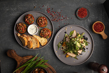 Eggplant appetizer with tomatoes and chicken fresh salad