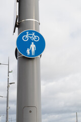 Blue and White Shared cycle and pedestrian lan or path sign on a lampost