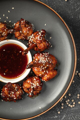 Chicken wings with soy sauce with beer and german pretzel