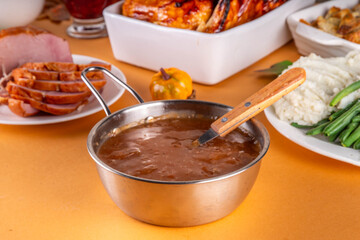 Homemade gravy sauce in small pot