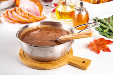 Homemade gravy sauce in small pot