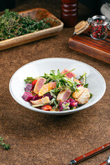 Portion of gourmet tuna salad with arugula