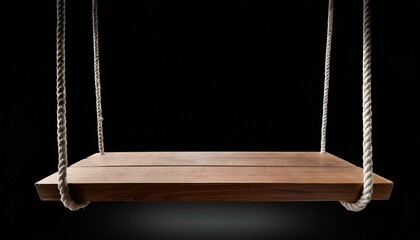 Wooden swing isolated on black background.