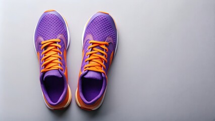 Top view of purple and orange trainers on flat background , fitness, athletic, shoes, sneakers, workout, running, exercise