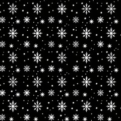 Black background with white snowflakes and stars creating a festive, winter-themed pattern.
