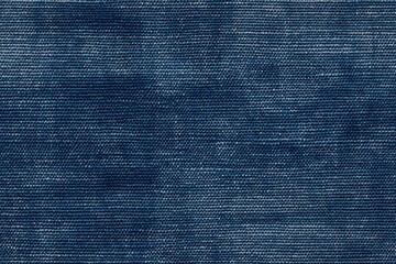 Dark blue cotton chambray denim fabric, showcasing its texture and weave. The fabric has a slightly worn appearance, typical of denim material, with subtle variations in color.