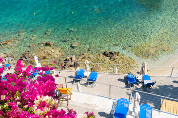 Paleokastritsa beach, small bay and Ionian sea clear water on Korfu, Greece