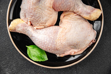 chicken meat legs raw poultry flesh on the bone gourmet fresh meal food snack on the table copy...