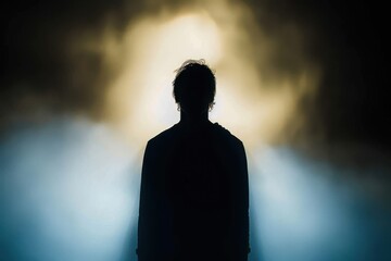 Silhouette of a man in the darkness. Night photography. Shadow in mist. Mysterious anonymous figure in darkness. Incognito person. Terrible nightmare. Ghost figure. Silhouette of man. Dark shadow. Sil