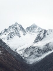 Obraz premium Majestic Snowy Mountain Range with Empty Sky Space Above