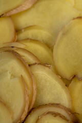 details of the ginger root used in cooking sliced into pieces