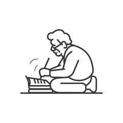 A man wearing glasses sits cross legged focused on writing