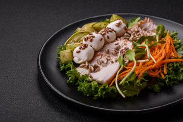 Delicious diet salad with turkey or chicken slices, lettuce, carrots, mozzarella