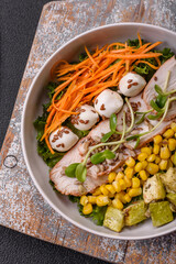 Delicious diet salad with turkey or chicken slices, lettuce, carrots, mozzarella