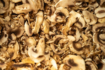 Close-up of champignon mushroom texture, showcasing smooth caps with fine gills and natural earthy tones, perfect for food backgrounds, culinary projects, or organic designs.