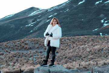 woman dressed in white on the mountain