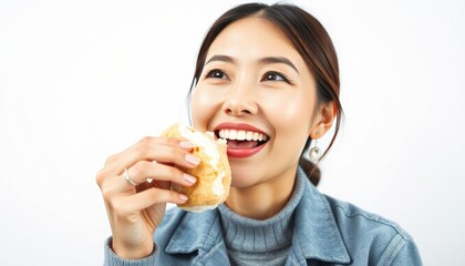 A ASIA WOMAN EATING A Cream Puff WITH A WHITE BACKGROUND